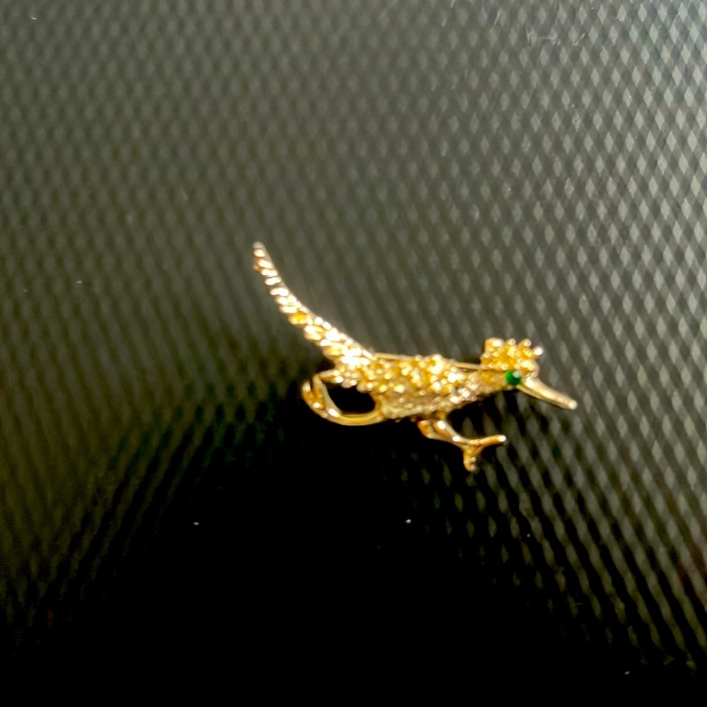 Roadrunner pin with vibrant green eye, costume jewelry, no markings,approx1 1/2”